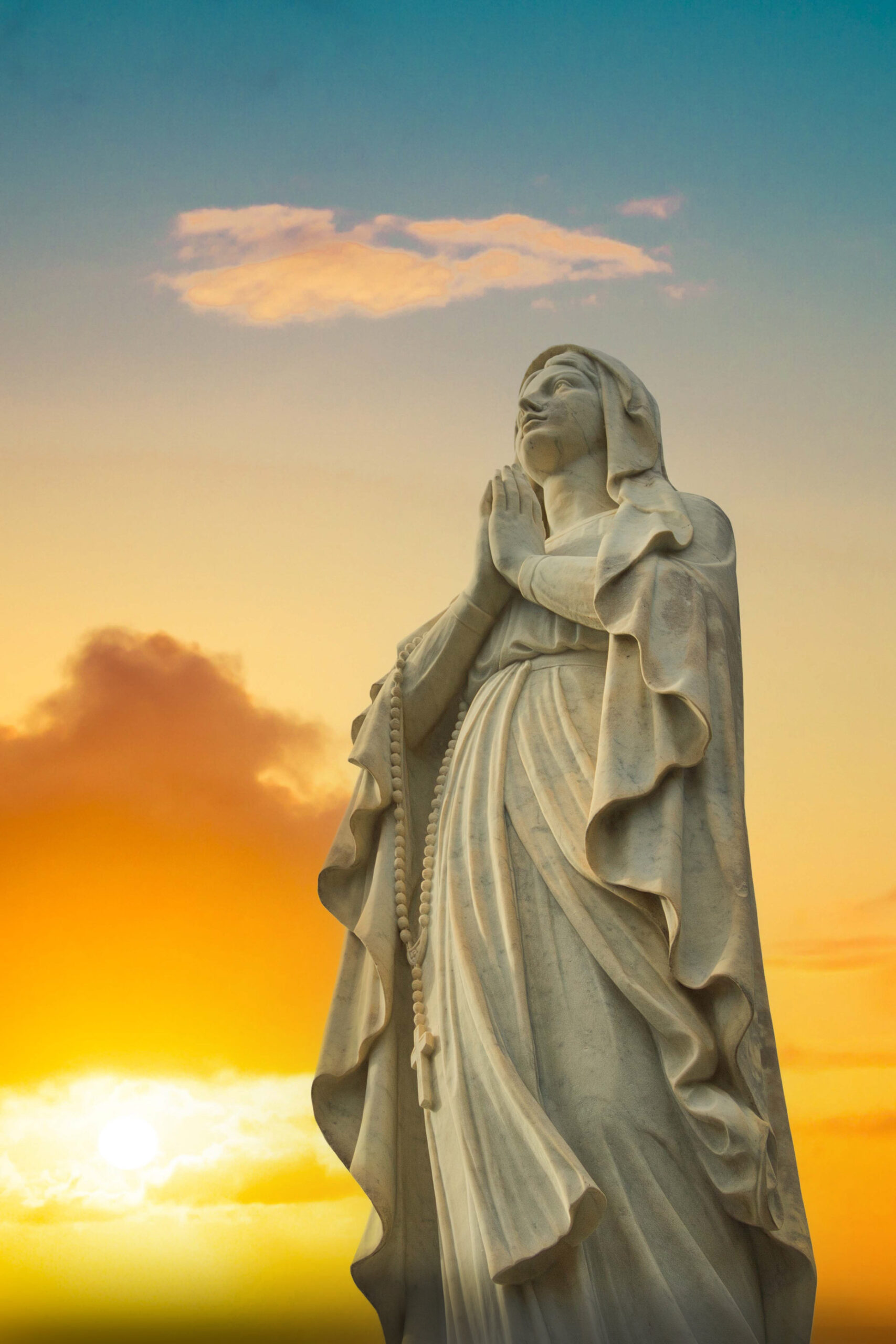 Blessed Mary statue at sunset